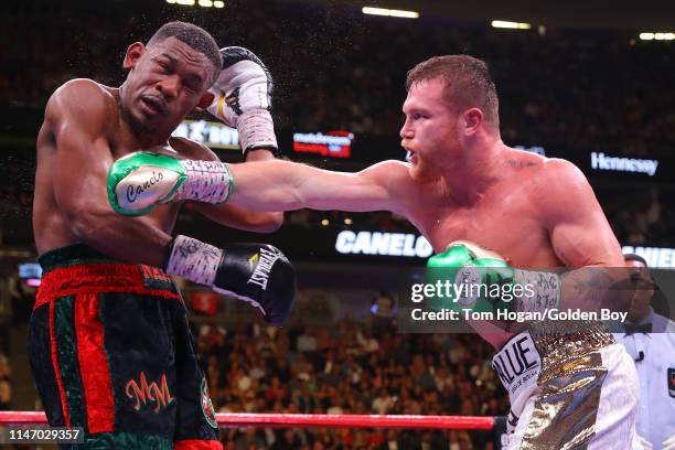 Canelo Alvarez punches Daniel Jacobs during their middleweight unification fight at T-Mobile Arena on May 04, 2019 in Las Vegas, Nevada.