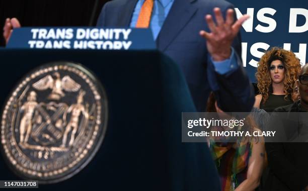 Woman looks on as New York City Mayor Bill de Blasio speaks during an event at the The Lesbian, Gay, Bisexual & Transgender Community Center in New...
