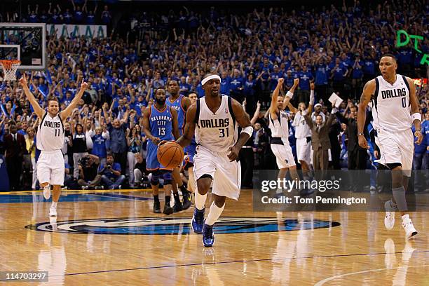 Jason Terry of the Dallas Mavericks moves the ball down court as Jose Juan Barea celebrates as the the Mavericks defeat the the Oklahoma City Thunder...