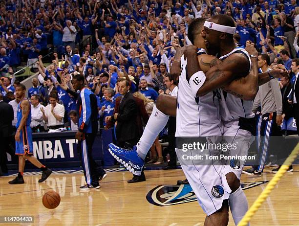 Shawn Marion and Jason Terry of the Dallas Mavericks celebrate as the Mavericks defeat the Oklahoma City Thunder 100-96 in Game Five of the Western...