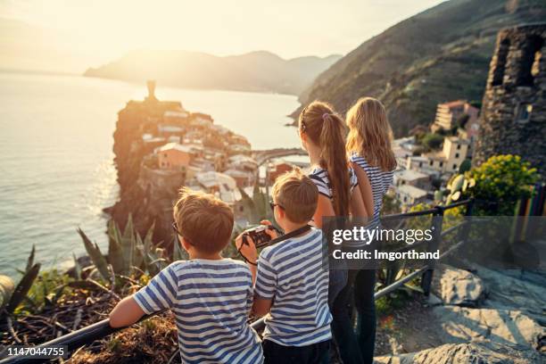 tourist enjoying sunset in vernazza, cinque terre, italy - italian family stock pictures, royalty-free photos & images