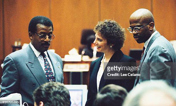 Defense attorney Johnnie Cochran confers with prosecutors Marcia Clark and Christopher Darden during testimony in the O.J. Simpson Criminal Trial...