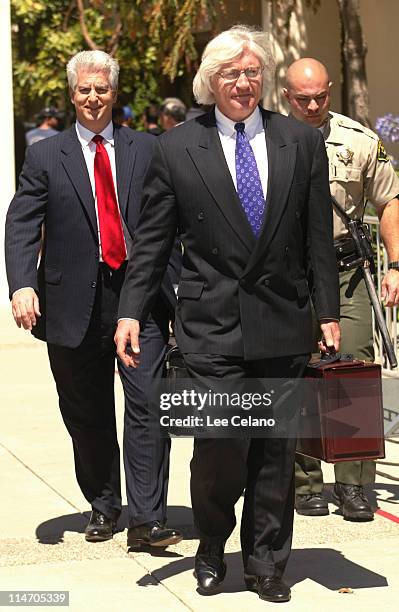 Thomas A. Mesereau, Jr. And Brian Oxman , attorneys for Michael Jackson, depart a pre-trial hearing in the entertainer's child molestation case at...