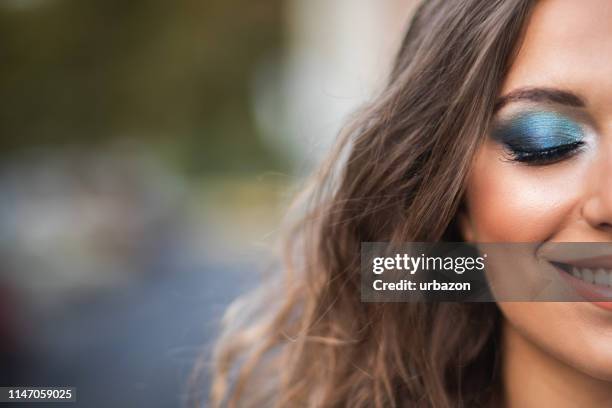 woman wearing professional make-up - colorful eye liner stock pictures, royalty-free photos & images