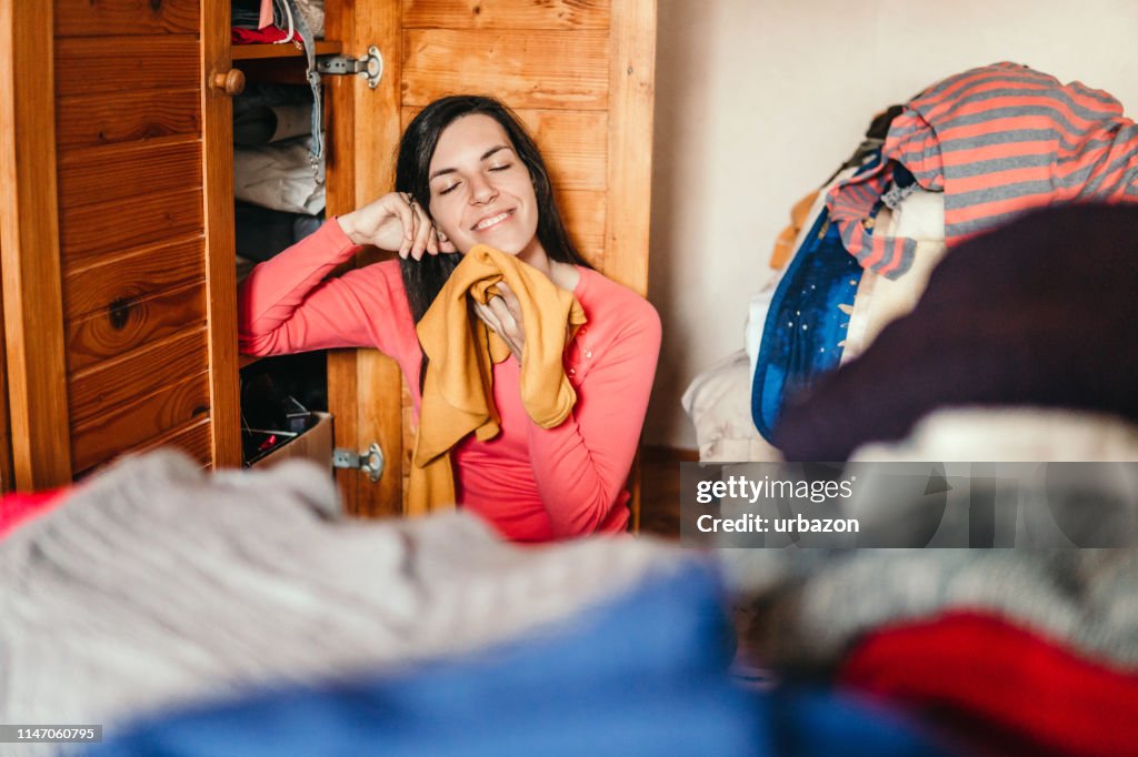 To Sort Out Woman Sorting Out Wardrobe High-Res Stock Photo - Getty Images