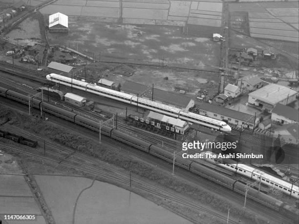 In this aerial image, a test train of Tokaido Shinkansen on June 26, 1962 in Odawara, Kanagawa, Japan.