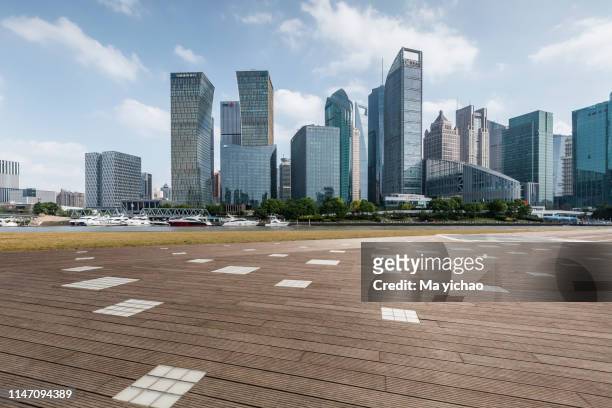 panoramic skyline with empty road - view of city square in shanghai china stock-fotos und bilder