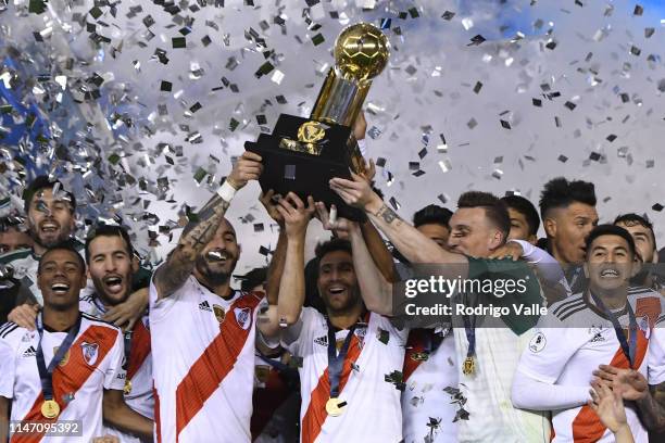 Leonardo Ponzio, Javier Pinola and Franco Armani lift the CONMEBOL Recopa cup after the second leg match of the final of the CONMEBOL Recopa...