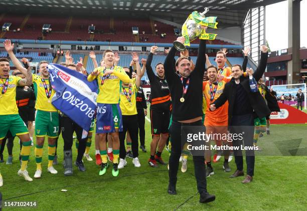 Captain Daniel Farke, Manager of Norwich City lifts the championship trophy in celebration after the Sky Bet Championship match between Aston Villa...
