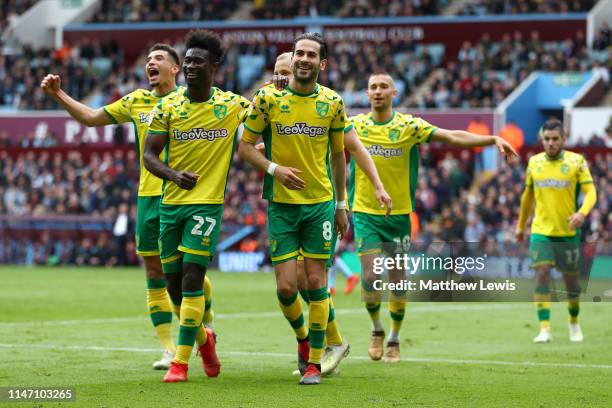 Mario Vrancic of Norwich City celebrates after scoring his team's second goal with team mates during the Sky Bet Championship match between Aston...