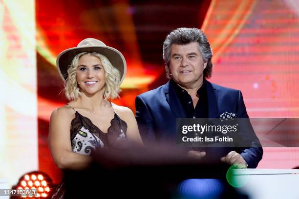 Swiss singer Beatrice Egli and Austrian singer Andy Borg during the television show 'Willkommen bei Carmen Nebel' at Velodrom on May 4, 2019 in...