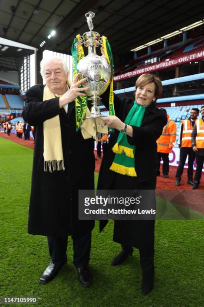 Delia Smith and husband Michael Wynn-Jones lift the championship trophy in celebration after the Sky Bet Championship match between Aston Villa and...