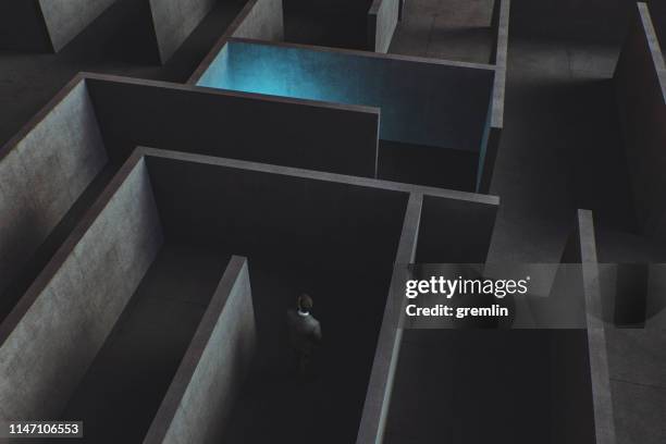 businessman lost in maze - on location for oblivion stock pictures, royalty-free photos & images