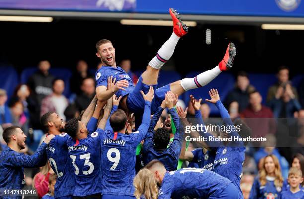 Gary Cahill of Chelsea is thrown in the air by team mates in celebration after the Premier League match between Chelsea FC and Watford FC at Stamford...