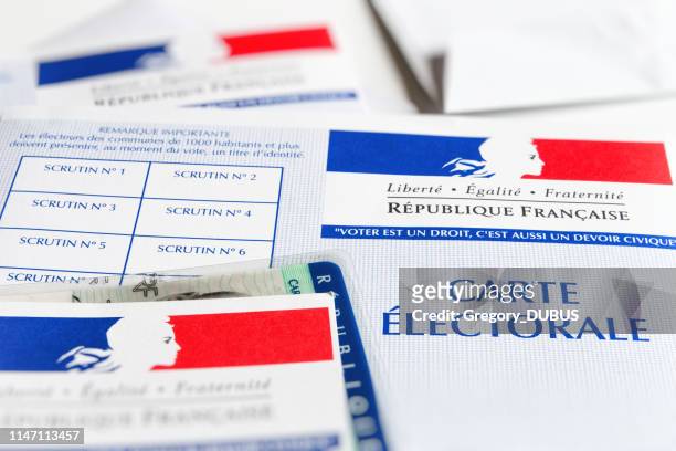 several french electoral voter cards official government allowing to vote paper close-up with identity card inside - french elections stock pictures, royalty-free photos & images