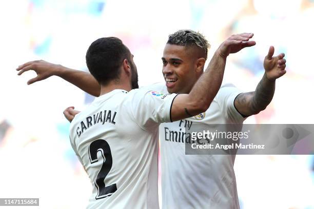 Mariano of Real Madrid celebrates after scoring his team's third goal with Daniel Carvajal during the La Liga match between Real Madrid CF and...