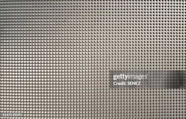 full frame shot of metallic structure - bumpy stock pictures, royalty-free photos & images