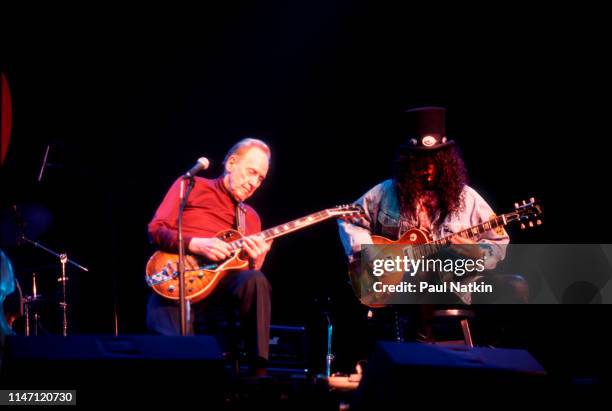 American Jazz and Blues musician Les Paul and British-American Rock musician Slash play guitars together at the House of Blues, Chicago, Illinois,...