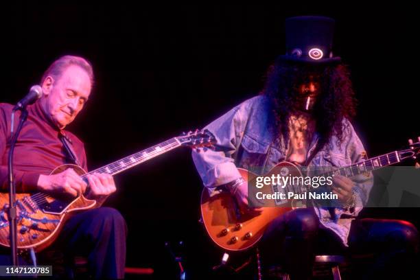 American Jazz and Blues musician Les Paul and British-American Rock musician Slash play guitars together at the House of Blues, Chicago, Illinois,...