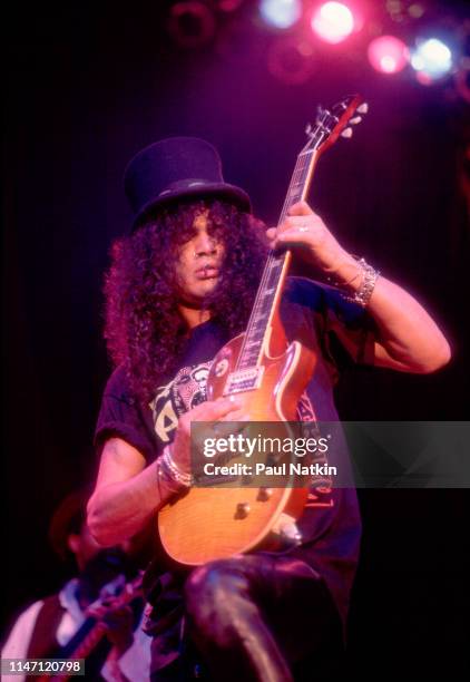 British-American Rock musician Slash plays guitar as he performs onstage at the House of Blues, Chicago, Illinois, December 2, 1996.