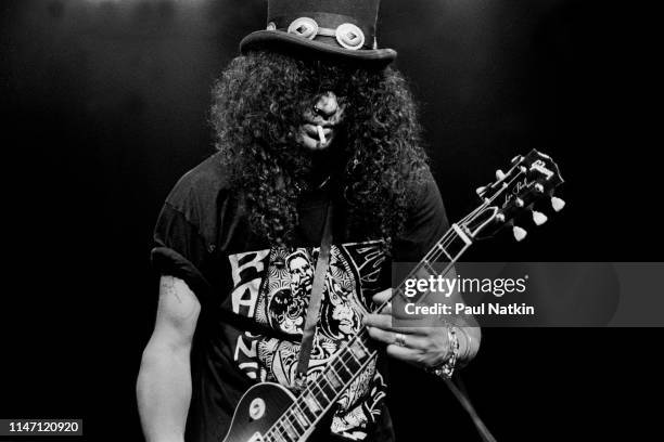 British-American Rock musician Slash plays guitar as he performs onstage at the House of Blues, Chicago, Illinois, December 2, 1996.