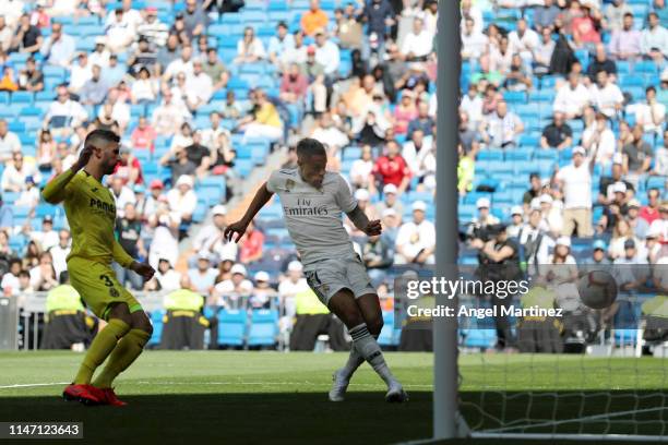 Mariano of Real Madrid scores his team's third goal during the La Liga match between Real Madrid CF and Villarreal CF at Estadio Santiago Bernabeu on...