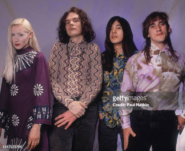 Portrait of the members of American Rock group Smashing Pumpkins as they pose in a photo studio, Chicago, Illinois, May 10, 1991. Pictures are, from...