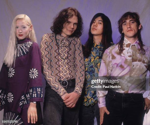 Portrait of the members of American Rock group Smashing Pumpkins as they pose in a photo studio, Chicago, Illinois, May 10, 1991. Pictures are, from...