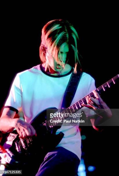 American Rock musician James Iha, of the group Smashing Pumpkins, plays guitar as he performs onstage at the World Music Theater, Tinley Park,...