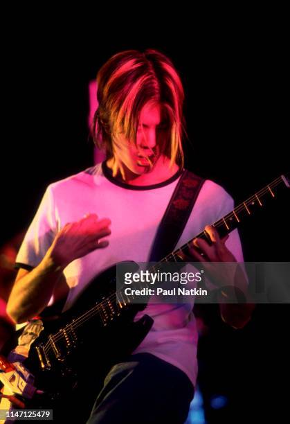 American Rock musician James Iha, of the group Smashing Pumpkins, plays guitar as he performs onstage at the World Music Theater, Tinley Park,...