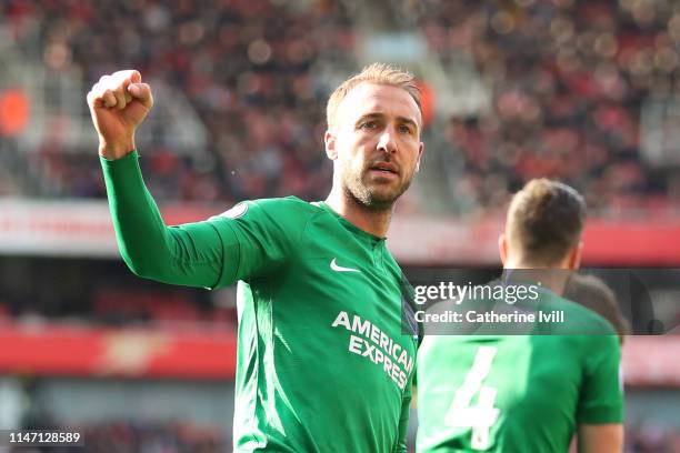 Glenn Murray of Brighton and Hove Albion celebrates after scoring his team's first goal from the penalty spot during the Premier League match between...