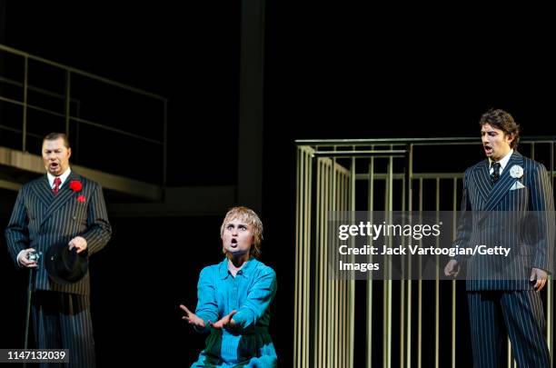 View of, from left, German bass Rene Pape , Russian soprano Marina Poplavskaya , and German tenor Jonas Kaufmann perform during the final dress...