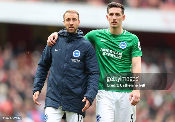 Glenn Murray and Lewis Dunk of Brighton and Hove Albion look on following the Premier League match between Arsenal FC and Brighton & Hove Albion at...