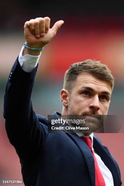 Aaron Ramsey of Arsenal shows emotion as he says farewell to the club following the Premier League match between Arsenal FC and Brighton & Hove...