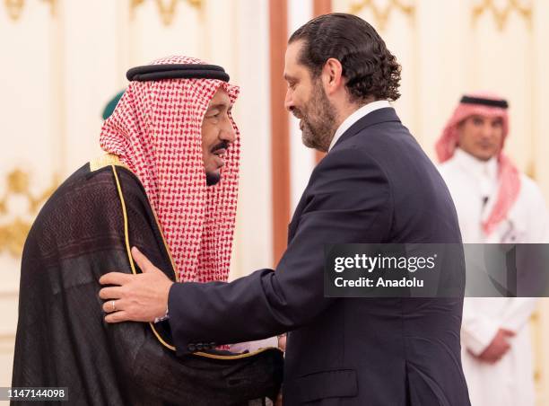 Saudi Arabia's King Salman bin Abdulaziz al-Saud welcomes Prime Minister of Lebanon Saad Hariri during an emergency Arab League Summit at Al Safa...