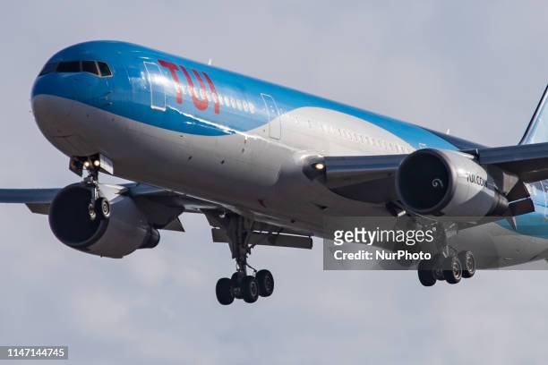 Airways wide body Boeing 767-300 aircraft landing at Tenerife South SUR Reina Sofia Airport TFS GCTS in a blue sky with clouds summer day, in...