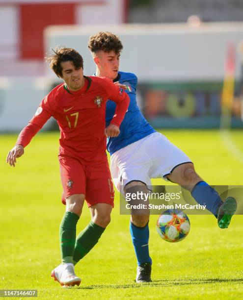 Dublin , Ireland - 13 May 2019; Matteo Ruggeri of Italy and Henrique Pereira of Portugal during the 2019 UEFA European Under-17 Championships...
