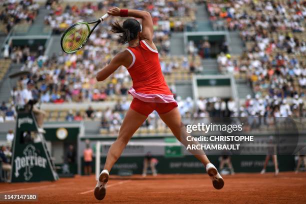 Latvia's Anastasija Sevastova returns the ball to Belgium's Elise Mertens during their women's singles third round match on day six of The Roland...