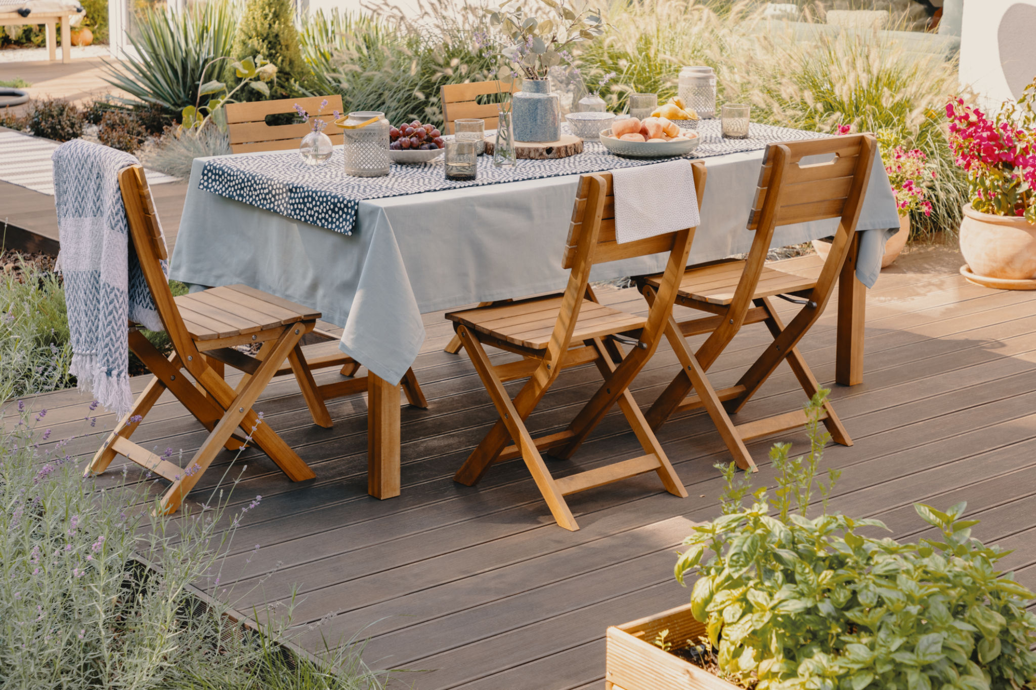 Real photo of a dining table with wooden chairs set on the terrace Real photo of a dining table with wooden chairs set on the terrace