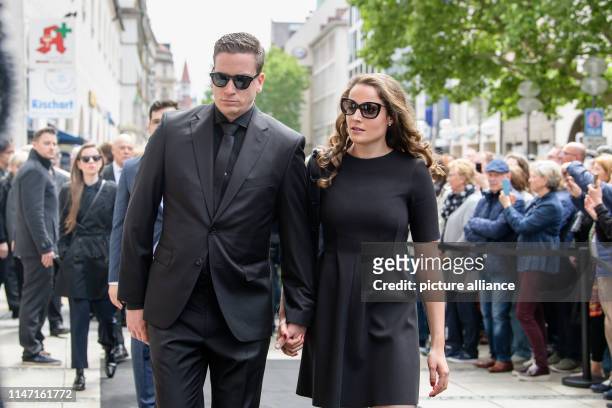 May 2019, Bavaria, Munich: Dominik Elsner, the son of Hannelore Elsner, and his girlfriend Michele Werner come to the public funeral service for...