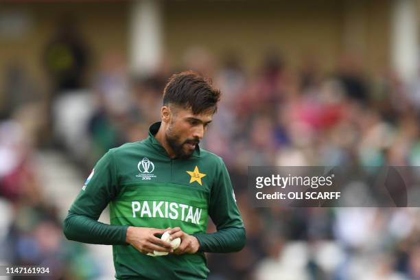 Pakistan's Mohammad Amir prepares to bowl during the 2019 Cricket World Cup group stage match between West Indies and Pakistan at Trent Bridge in...