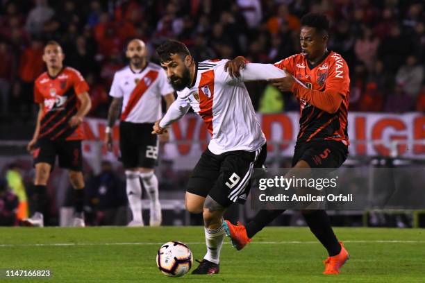 Lucas Pratto of River Plate fights for the ball with Wellington Aparecido Martins of Paranaense during the second leg match of the final of the...