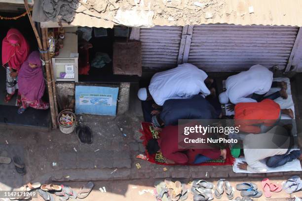 Muslims devotee offer prayer on a road outside in Mumbai, India on 31 May 2019. Muslims around the world abstain from eating, drinking and smoking...