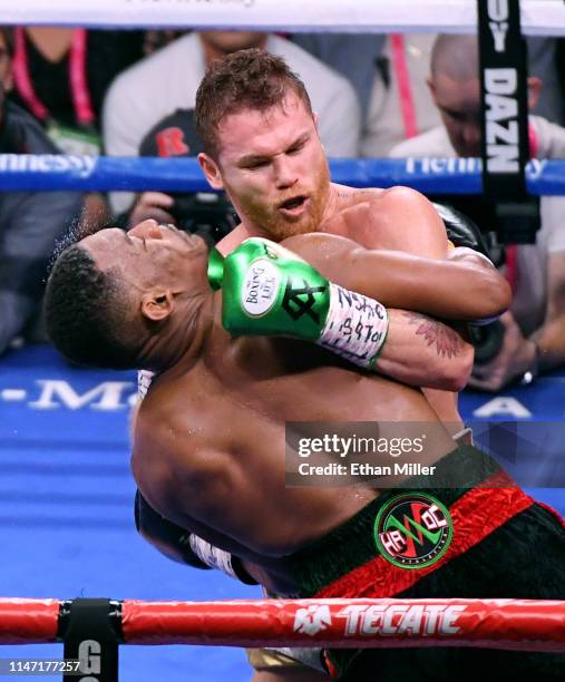 Daniel Jacobs and Canelo Alvarez battle in the third round of their middleweight unification fight at T-Mobile Arena on May 4, 2019 in Las Vegas,...