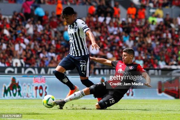 Jesus Gallardo of Monterrey and Esteban Carvajal of Atlas fight for the ball during the 17th round match between Atlas and Monterrey as part of the...