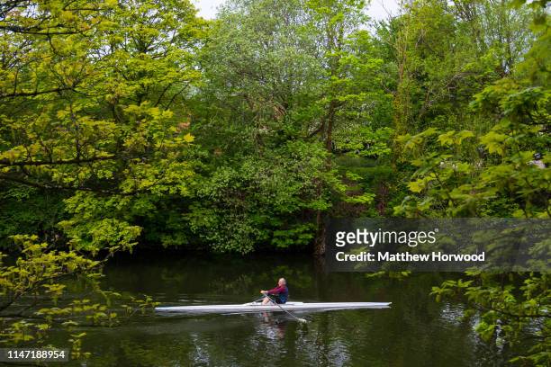 Man rows in a rowing boat on the River Taff on May 1, 2019 in Cardiff, United Kingdom.
