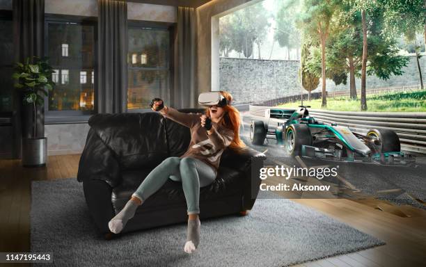 woman in vr glasses. virtual reality with racing cars on the track - car racing video game stock pictures, royalty-free photos & images