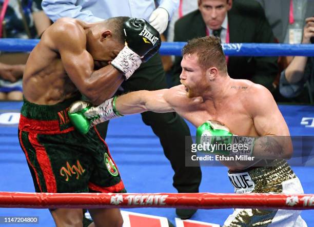 Canelo Alvarez hits Daniel Jacobs in the fourth round of their middleweight unification fight at T-Mobile Arena on May 4, 2019 in Las Vegas, Nevada....