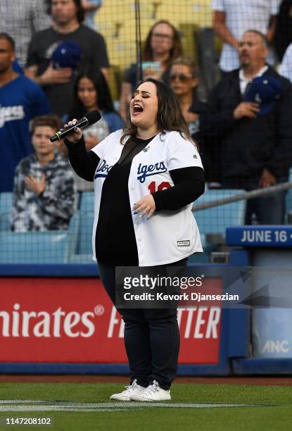 Singer and actor Nikki Blonsky, best known for starring in the 2007 movie musical "Hairspray," sings the National Anthem during the seventh annual...