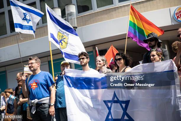 Demonstrators wave Israeli national flags during a pro-Israeli demonstration, June 1, 2019 in Berlin, Germany. Critics accuse the Al-Quds marchers of...